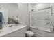 A bright bathroom with a shower over bath, a sink and a toilet at 155 Marsh Deer Place, Surfside Beach, SC 29575