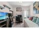 This bedroom showcases a daybed, desk, shelving and a well-lit workspace at 155 Marsh Deer Place, Surfside Beach, SC 29575