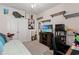 The room is decorated with shelves, a media stand with a TV, and unique wall art at 155 Marsh Deer Place, Surfside Beach, SC 29575