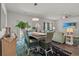 Charming dining area with unique chandelier, open to living space for a cozy atmosphere at 155 Marsh Deer Place, Surfside Beach, SC 29575