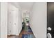 Inviting entryway with hardwood floors and neutral walls that leads into the open-concept living space at 155 Marsh Deer Place, Surfside Beach, SC 29575