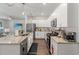 Bright and airy kitchen with white cabinets, granite countertops, and stainless steel appliances, perfect for cooking at 155 Marsh Deer Place, Surfside Beach, SC 29575