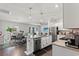 Modern kitchen with stainless steel appliances, granite countertops, and a large island with pendant lighting at 155 Marsh Deer Place, Surfside Beach, SC 29575