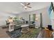 Spacious living room with hardwood floors, ample seating, and natural light, perfect for relaxing and entertaining at 155 Marsh Deer Place, Surfside Beach, SC 29575