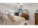 Comfortable main bedroom featuring a TV, a ceiling fan, dressers and a light color scheme at 155 Marsh Deer Place, Surfside Beach, SC 29575