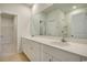 Bright bathroom featuring double sinks, white cabinets, and a large mirror at 162 Waterloo Sunset Dr., Longs, SC 29568