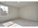 Sunny bedroom with neutral carpet and a large window view at 162 Waterloo Sunset Dr., Longs, SC 29568
