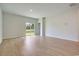 Light-filled living room with sliding glass doors to the backyard and wood-look floors at 162 Waterloo Sunset Dr., Longs, SC 29568