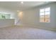 Upstairs loft space with neutral carpet and great natural lighting at 162 Waterloo Sunset Dr., Longs, SC 29568