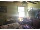 Bedroom with natural light, bedside table, dark wood dresser, and ceiling fan at 1769 Crooked Pine Rd., Surfside Beach, SC 29575