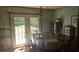 Dining room with table, chairs, and glass paneled doors leading to backyard at 1769 Crooked Pine Rd., Surfside Beach, SC 29575