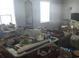 Game room cluttered with pool table, sofa, and other household items at 1769 Crooked Pine Rd., Surfside Beach, SC 29575