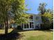 Inviting backyard with a screened-in porch and upper balcony, providing comfortable outdoor living spaces at 18 Trigger Fish Ln., Murrells Inlet, SC 29576