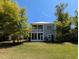 Spacious backyard featuring a screened-in porch and balcony, perfect for enjoying the outdoors in comfort at 18 Trigger Fish Ln., Murrells Inlet, SC 29576