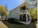 Back exterior with a well maintained lawn and an elevated deck offering an outside relaxation space at 18 Trigger Fish Ln., Murrells Inlet, SC 29576