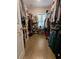 Walk-in closet with built-in shelves and hanging rods for ample storage at 18 Trigger Fish Ln., Murrells Inlet, SC 29576