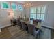 Dining room features a rectangular table with seating for six and decorative lighting at 18 Trigger Fish Ln., Murrells Inlet, SC 29576