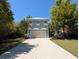 Beautiful two-story home with a long driveway and a well manicured lawn that accentuates its appeal at 18 Trigger Fish Ln., Murrells Inlet, SC 29576