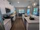 Modern kitchen with white cabinets, stainless steel appliances, and a long island with seating at 18 Trigger Fish Ln., Murrells Inlet, SC 29576