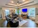 Spacious living room features recessed lighting, a ceiling fan, and a large sectional sofa at 18 Trigger Fish Ln., Murrells Inlet, SC 29576