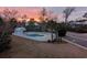 Community pool surrounded by landscaping and mature trees, perfect for neighborhood enjoyment at 18 Trigger Fish Ln., Murrells Inlet, SC 29576