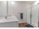 Well-lit bathroom featuring a double sink vanity and a glass-enclosed shower at 1804 Castlebay Dr., Conway, SC 29526