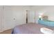 Bright bedroom with a blue dresser, and a bed with decorative pillows at 1804 Castlebay Dr., Conway, SC 29526