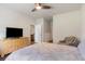 Neutral bedroom featuring a TV on a dresser and an open doorway to the kitchen at 1804 Castlebay Dr., Conway, SC 29526
