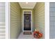 Close up of a homes front door with decorative wreath and flowers at 1804 Castlebay Dr., Conway, SC 29526