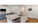 Kitchen island with stainless steel sink and dishwasher with view to the living room at 1804 Castlebay Dr., Conway, SC 29526