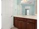 Bathroom with a large mirror, wood vanity with marble top, and a white door at 1881 Willowcress Ln., Myrtle Beach, SC 29577