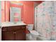 Bathroom featuring colorful shower curtain and a wooden vanity with marble countertops at 1881 Willowcress Ln., Myrtle Beach, SC 29577