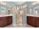 Bright bathroom with double vanity sinks and walk-in shower featuring glass doors at 1881 Willowcress Ln., Myrtle Beach, SC 29577