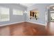 Dining area with hardwood floors and a pass-through window to the kitchen at 1881 Willowcress Ln., Myrtle Beach, SC 29577