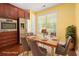 Dining area featuring a table setting, stainless steel fridge, and a bright window at 1881 Willowcress Ln., Myrtle Beach, SC 29577