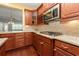 Close up of the gas cooktop and granite counters in this kitchen with mosaic tile backsplash at 1881 Willowcress Ln., Myrtle Beach, SC 29577