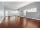 Bright living room featuring hardwood floors, many windows, and a modern ceiling fan at 1881 Willowcress Ln., Myrtle Beach, SC 29577