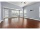 Spacious living room with hardwood floors, many windows, and access to the patio at 1881 Willowcress Ln., Myrtle Beach, SC 29577
