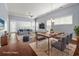 Staged living room with hardwood floors, ample natural light, and stylish furnishings at 1881 Willowcress Ln., Myrtle Beach, SC 29577