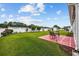 This backyard features a well-maintained lawn, a patio, and a surrounding fence at 195 Cupola Dr., Longs, SC 29568