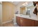 Bright bathroom featuring double sinks, a large mirror, and a shower-tub combination at 195 Cupola Dr., Longs, SC 29568