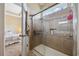 This bathroom features a tiled walk-in shower with glass door and a storage niche at 195 Cupola Dr., Longs, SC 29568