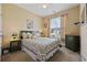 Comfortable bedroom with a queen-sized bed, soft lighting, and a view of the outdoors at 195 Cupola Dr., Longs, SC 29568