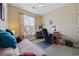 Comfortable bedroom with a full-sized bed, complemented by a desk and natural light at 195 Cupola Dr., Longs, SC 29568