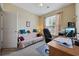 Comfortable bedroom with a full-sized bed, complemented by a desk and natural light at 195 Cupola Dr., Longs, SC 29568