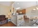 Open-concept kitchen with breakfast bar seating, wood cabinetry, and modern appliances at 195 Cupola Dr., Longs, SC 29568