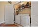 A well-organized laundry room features modern appliances and plenty of shelving for storage at 195 Cupola Dr., Longs, SC 29568