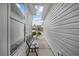 Exterior walkway showcasing a narrow space between two homes and a bench at 195 Cupola Dr., Longs, SC 29568