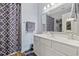 Bathroom featuring a white vanity, mirror, shower with patterned curtain at 2090 Cross Gate Blvd. # 202, Surfside Beach, SC 29575