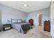 Cozy bedroom with neutral walls, ceiling fan, dresser and carpeted floors at 2090 Cross Gate Blvd. # 202, Surfside Beach, SC 29575